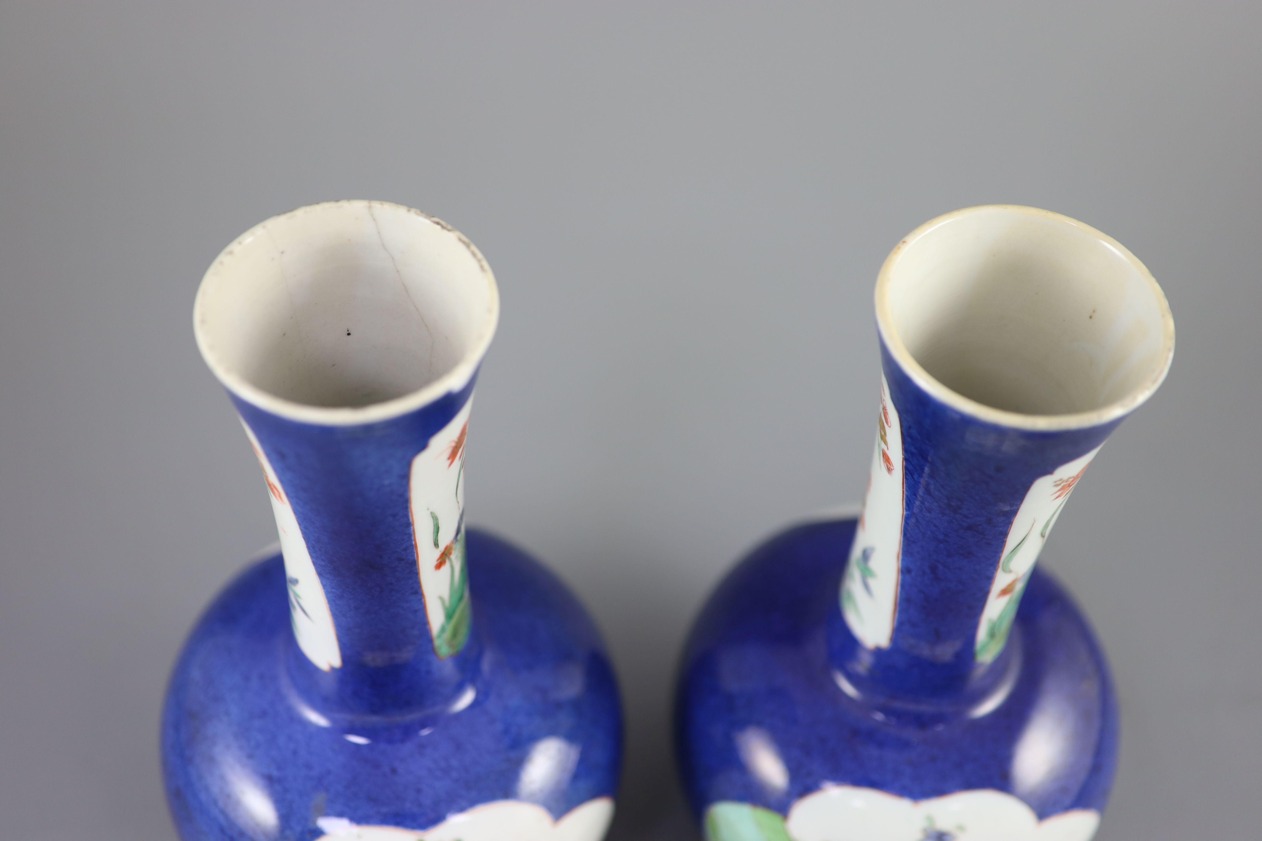 A pair of Chinese powder blue famille verte bottle vases, Kangxi period (1662-1722), 26cm high
